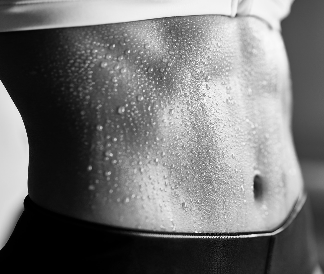 Close up of a woman's wet torso, black and white photo